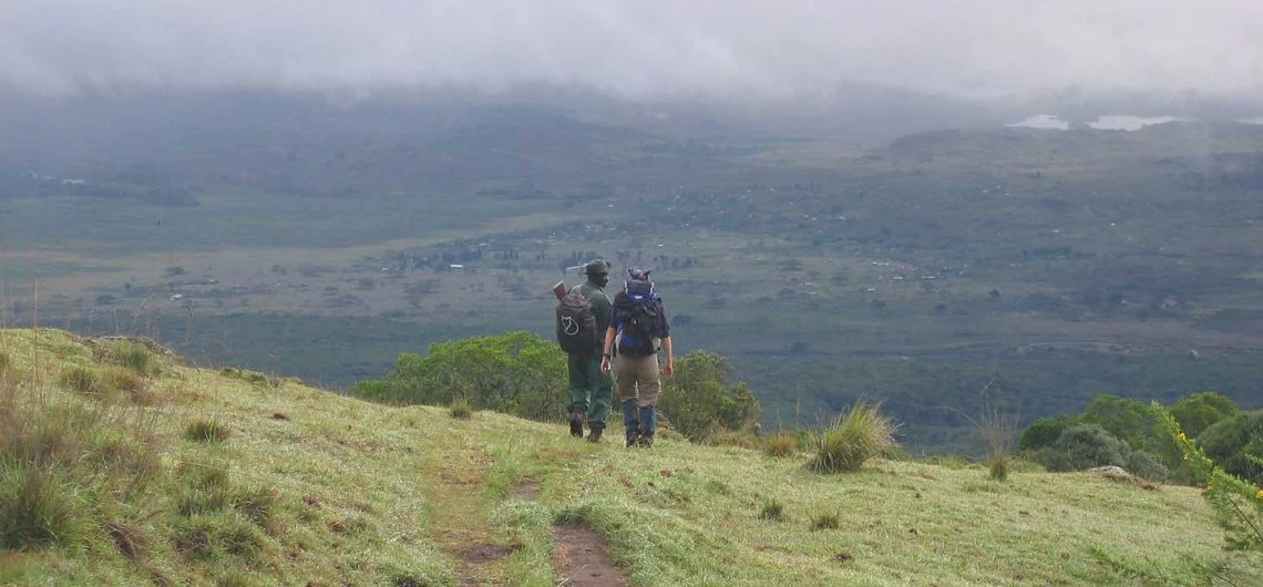 Armed ranger climbing Mount Meru