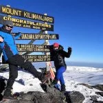 Standing on top of Kilimanjaro uhuru Peak
